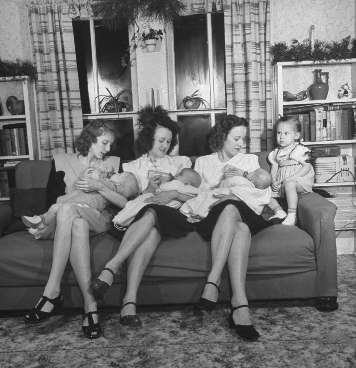 #11 Daughters of James Ferdinand Irwin bottle-feeding their babies at Christmas family reunion celebration marking the return of Irwin’s sons fr. service in WWII, L-R: Jeanne Haney & son Joe, Myra Lee Love & son John, Betty Roush and her daughters Julia Ann .