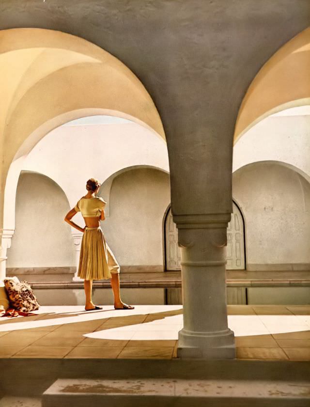 #2 Natalie Paine in bleached beige high tiny top and ingenious combination of skirt and knickers, the one joined inseparably to the other, by Grès, June 1950