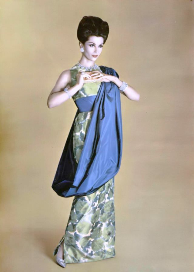 #36 Jean Newington in blue and green print taffeta evening gown with blue taffeta circular stole, by Grès, jewelry by Van Cleef & Arpels, 1959