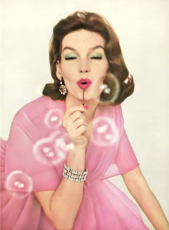 #37 Joanna McCormick in frothy tulle pink ball gown by Grès, Rue de la Pink lipstick by Coty, Vogue, April 15, 1959