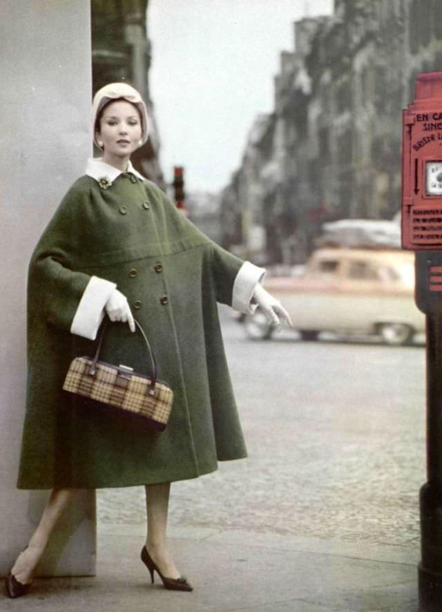 #39 Model in cozy reversible wool coat by Grès, hat by Jean Barthet, shoes by Charles Jourdan, 1959
