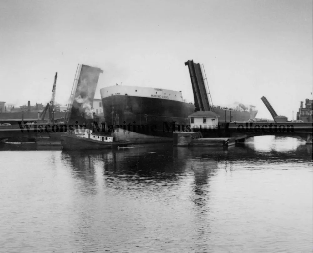 #9 Steamer Tug Reiss towing the Marine Angel through to Manitowoc Bridge, 1953.