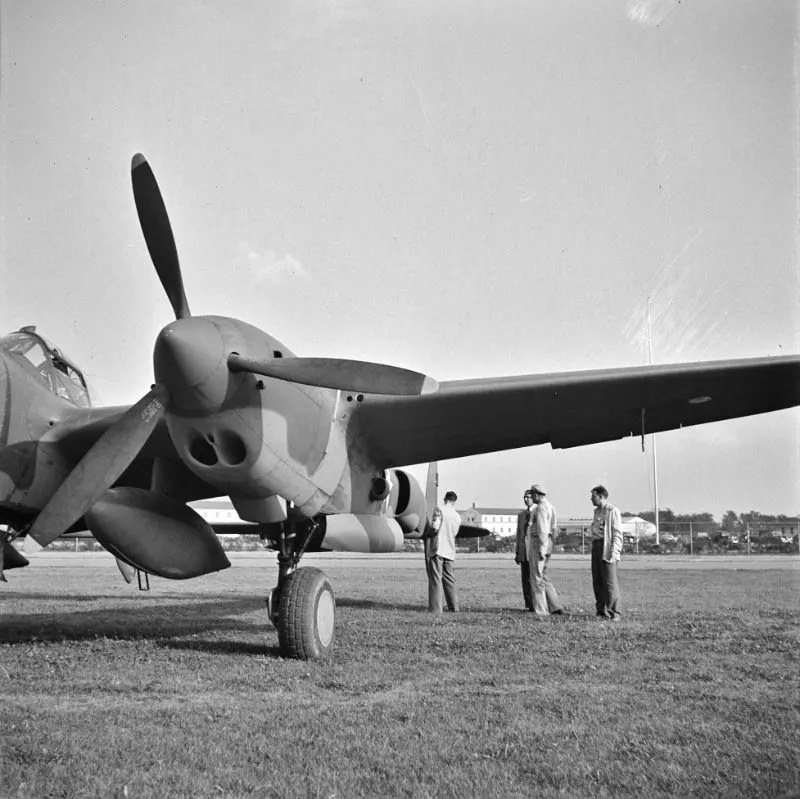 #10 A United States Army Air Corps air ferry command base sixteen miles from Detroit, Michigan at Wayne County Airport. Factory inspector and Captain Roddy inspect a new P-38, in September 1942.