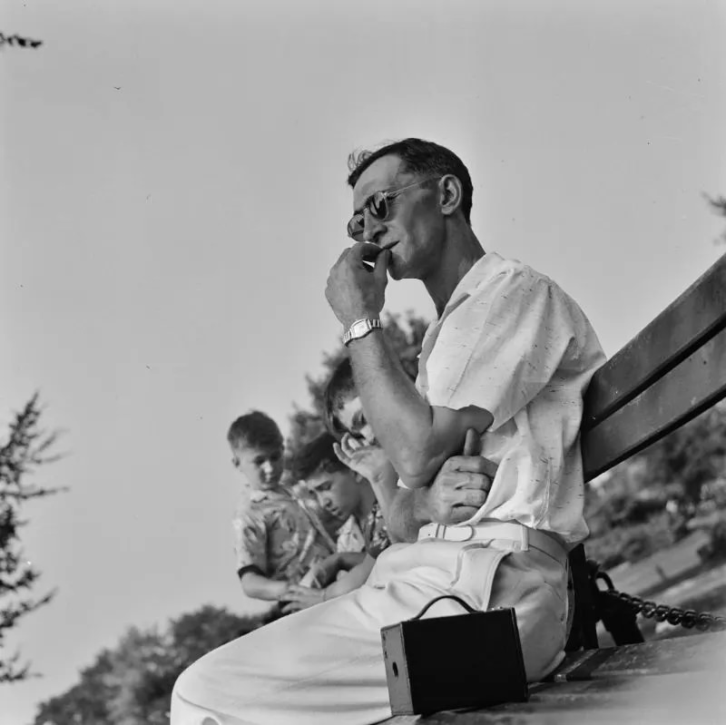 #11 A Worker resting on a park bench in the zoological park, Detroit, Michigan, July 1942.