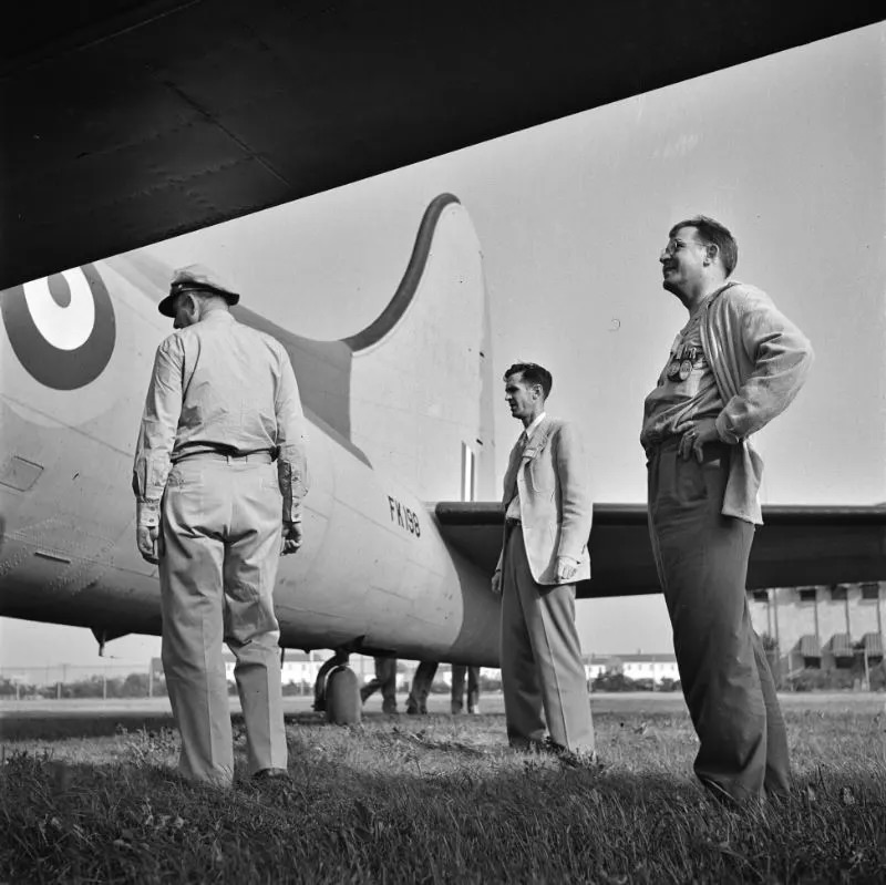 #34 Workers inspecting a plane at the Wayne County Airport, a United States Army Air Corps air ferry command base sixteen miles from Detroit, Michigan, September 1942.