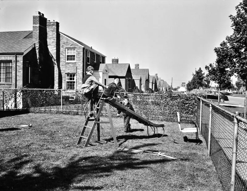 #35 Workers’ children playing in the front yard, Detroit (vicinity), Michigan, September 1942.