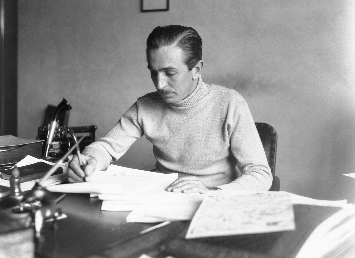 Walt Disney Working in his Studio. Scores of artists and sound experts work in the Mickey Mouse Studios just outside of Los Angeles making thousands of drawings and accompaniment under the direction of Walt DisneyAnimator Drawing Mickey Mouse at Disney Studios, 1930s