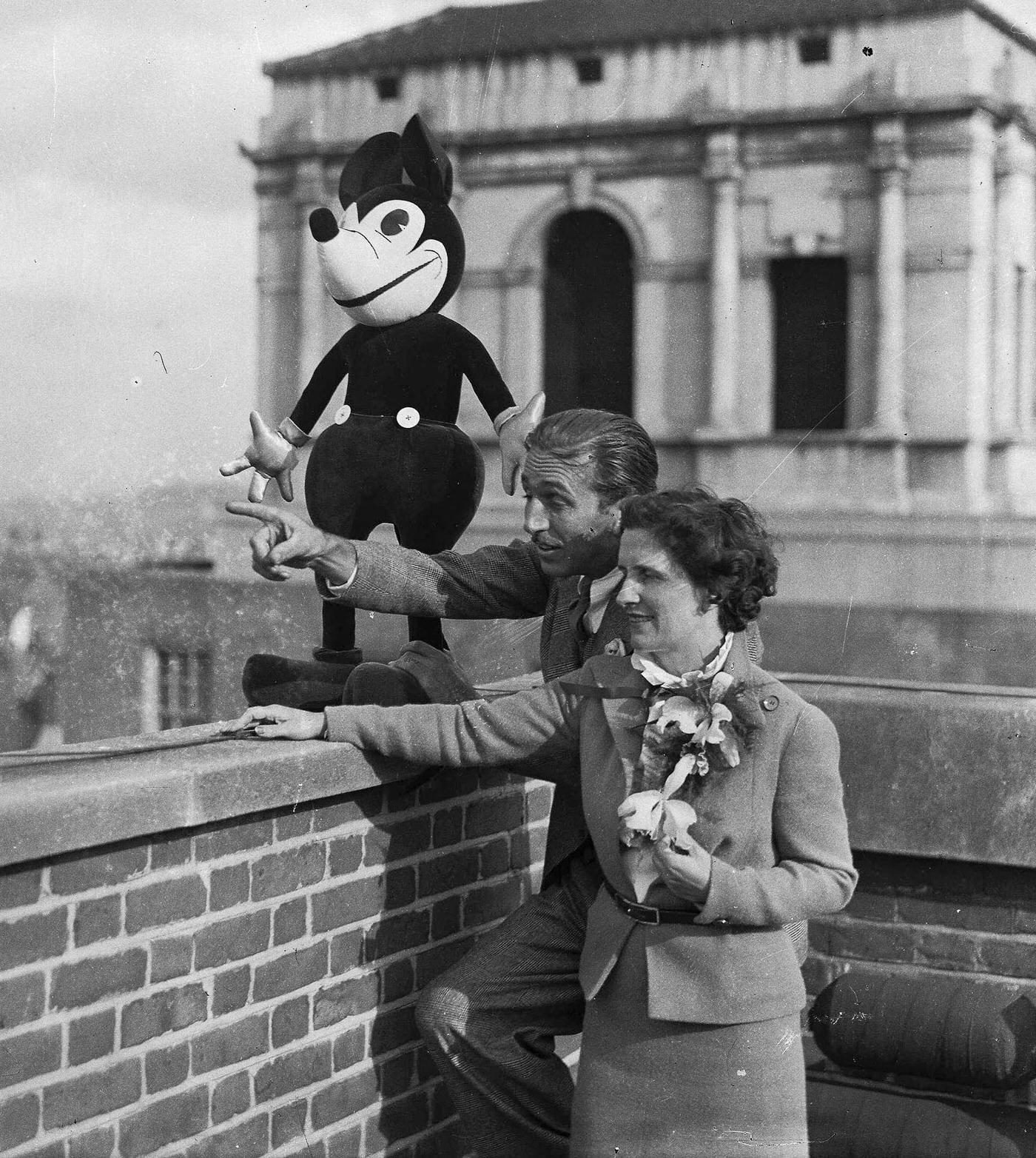 #35 Walt Disney and his wife, Lillian with Mickey Mouse on the roof of their London Hotel, 1935