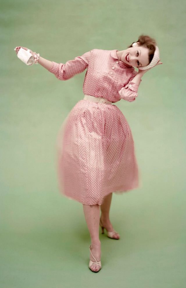 #16 Model in a pink with white polka dot silk surah dress by Mollie Parnis and reverse dot beret, Vogue, March 1, 1955