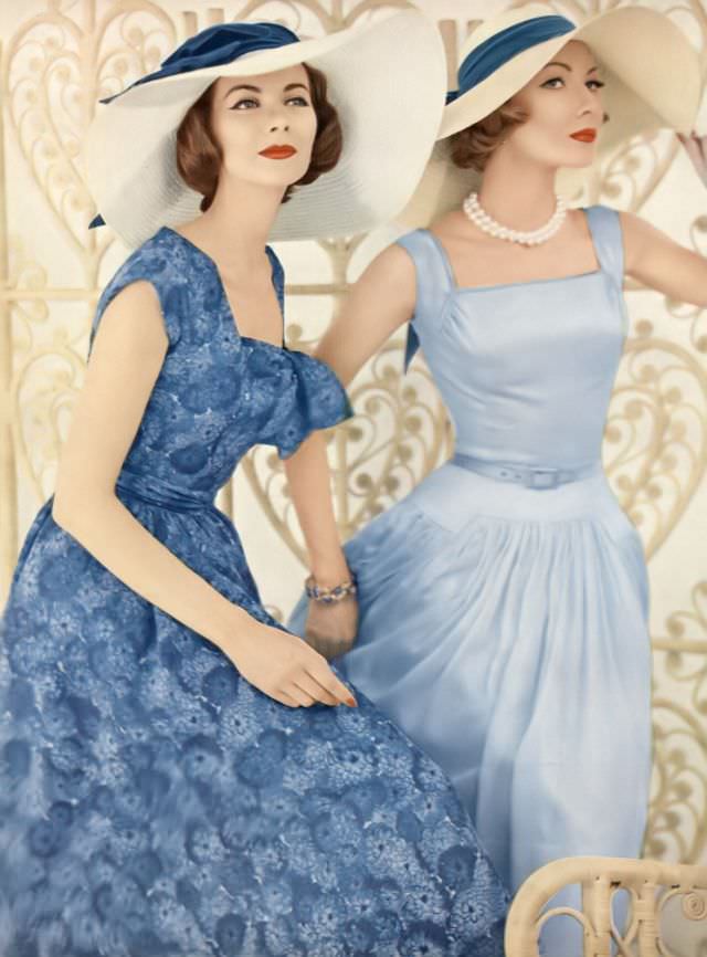 #20 Joan Friedman and Jessica Ford in pretty thin-as-air cotton shiffon dresses by Mollie Parnis, hats by Emme, December 1, 1956