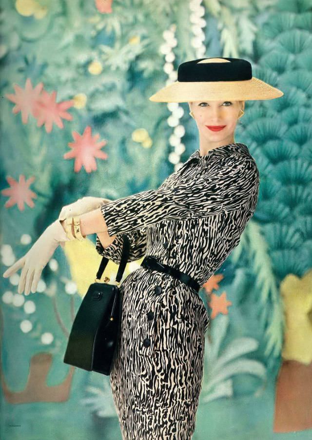 #21 Sunny Harnett in silk printed sheath with short bolero by Mollie Parnis, Vogue, 1956