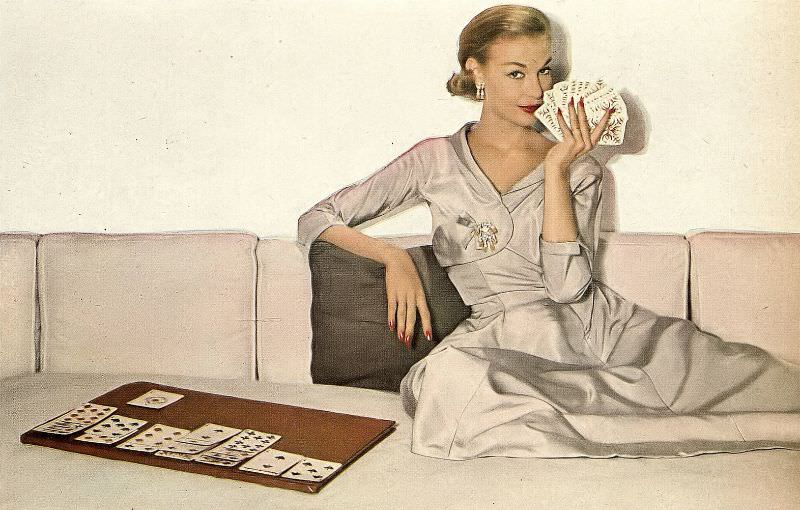 #5 Liz Pringle in pale silk dinner dress with small matching jacket by Mollie Parnis, Harper’s Bazaar, October 1952
