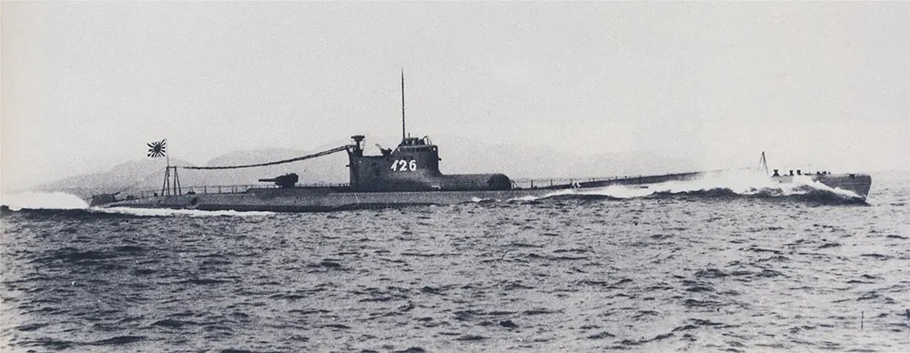 #10 Japanese submarine I-26. The bulbous plane hangar and the catapult are visible forward of the conning tower.