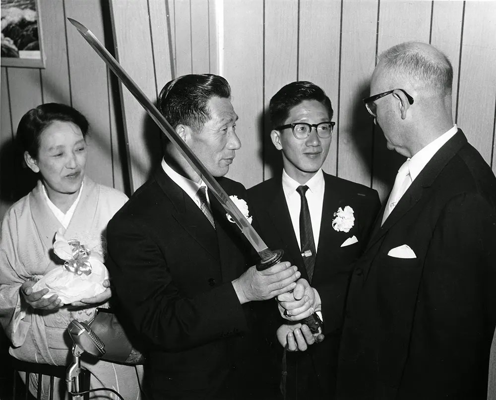 #18 Nobuo Fujita presents his family’s Samurai sword to Brookings, Oregon in 1962.