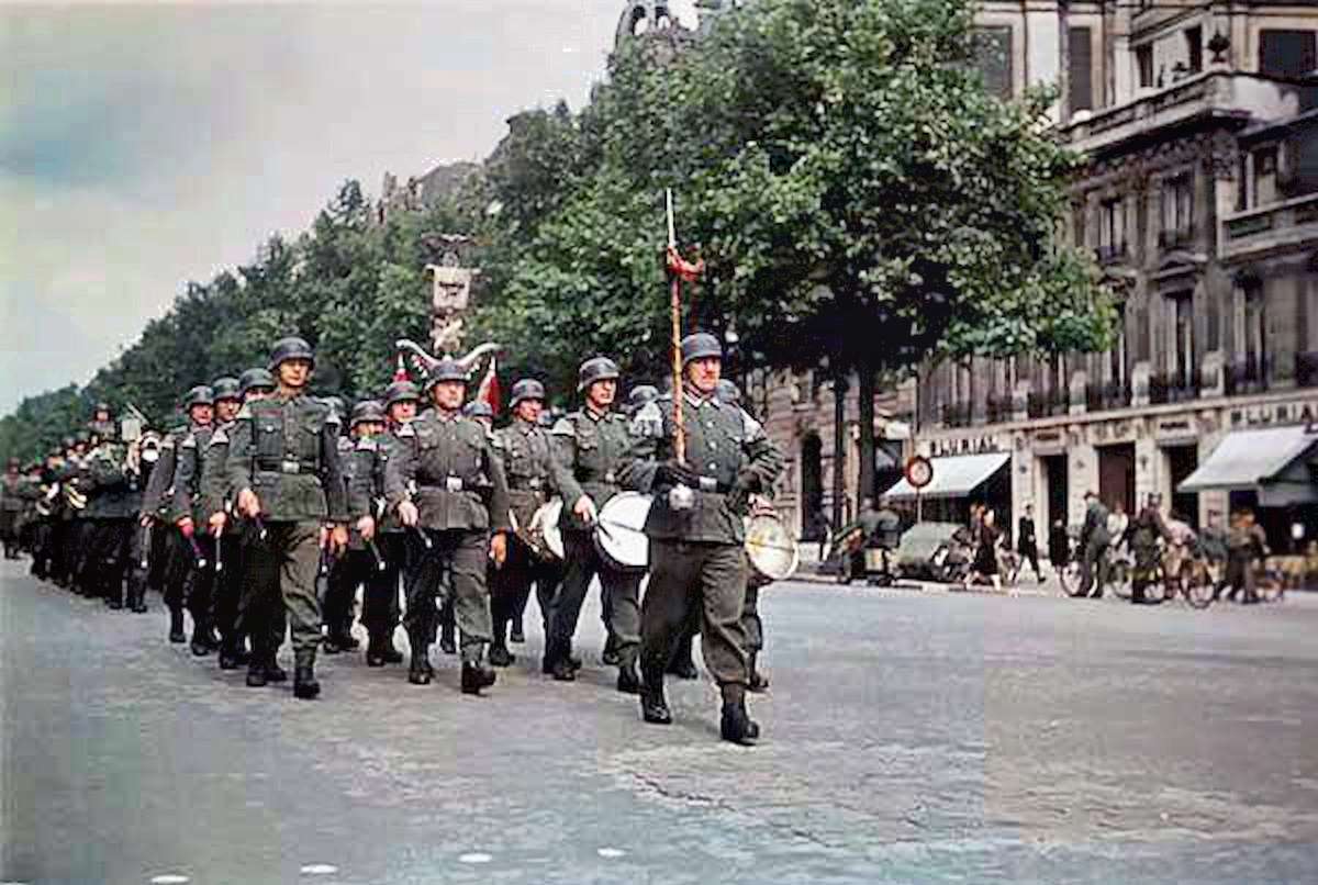 #6 Stern-looking soldiers from the Wehrmacht march down one of the city’s broad boulevards.