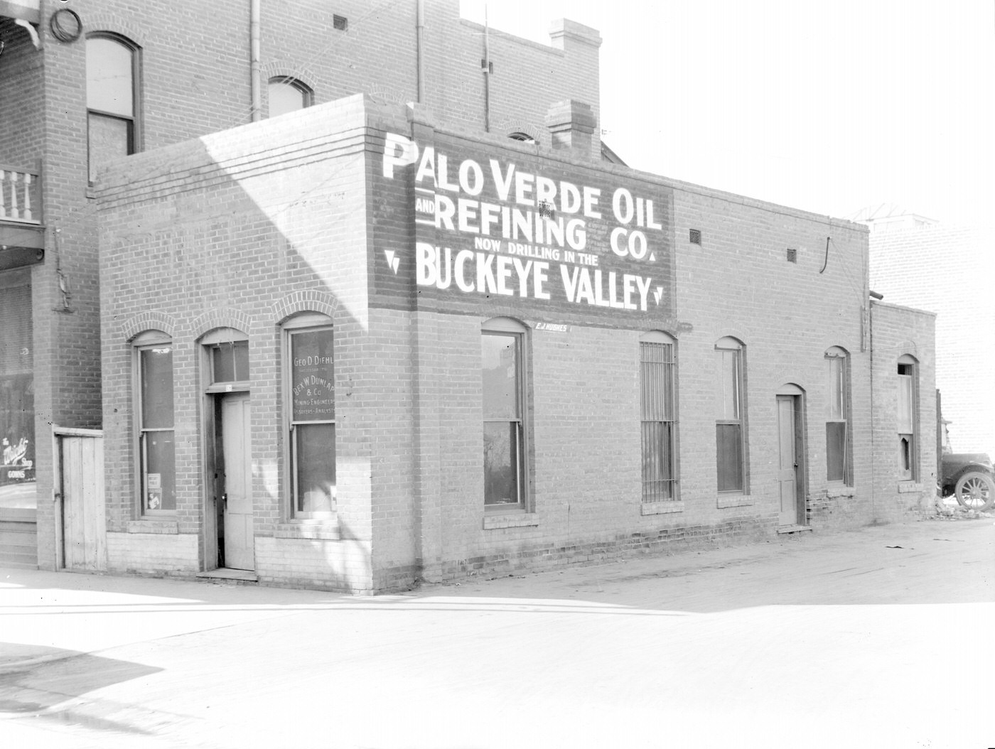 #140 George D. Diehl Building, 1930s. Sign on the building reads “Palo Verde Oil and Refining Co. Now Drilling in the ‘Buckeye Valley.'” This building was located at 18 N. 2nd Ave. in Phoenix.