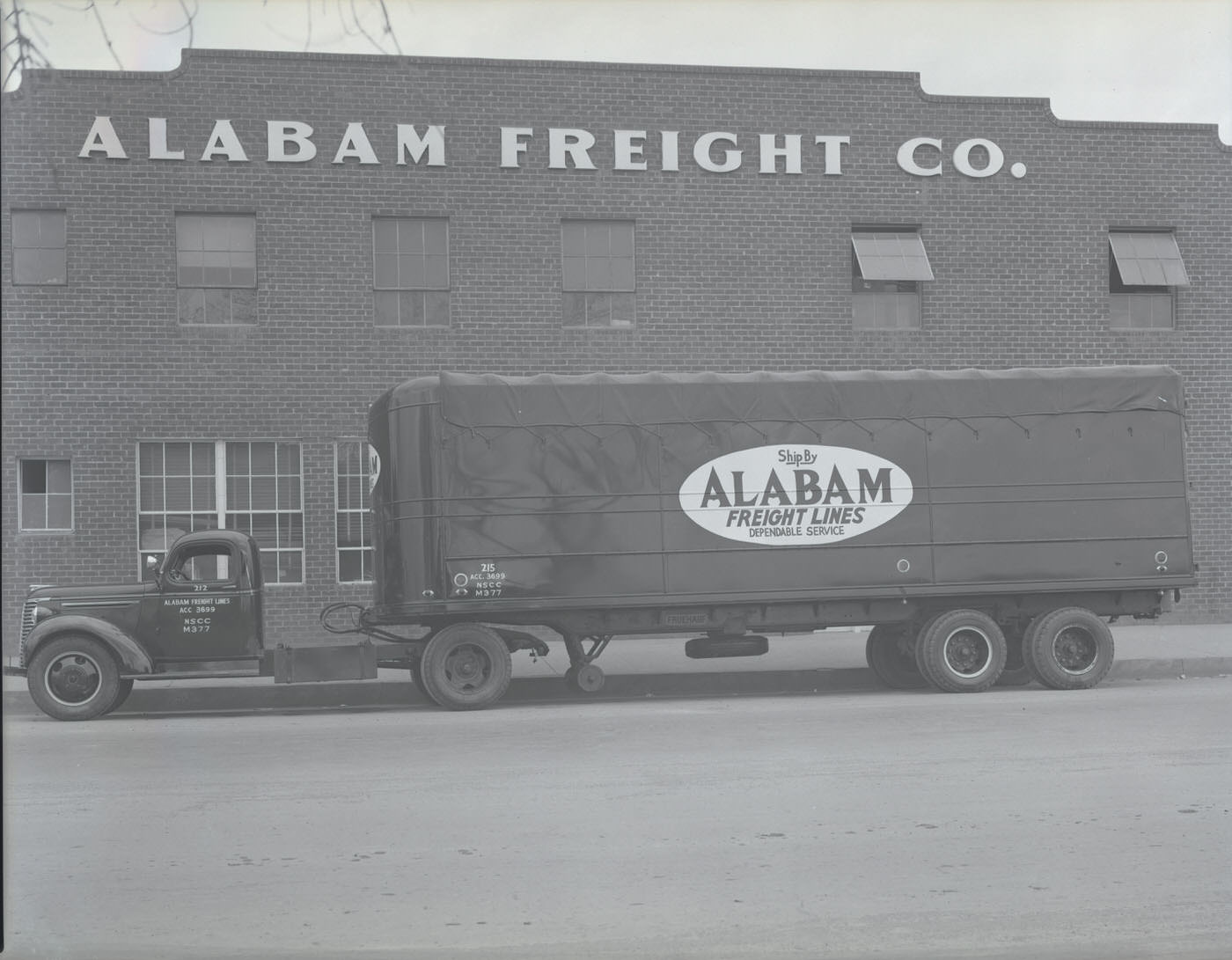 #31 Alabam Freight Co. Truck Outside Building, 1930s