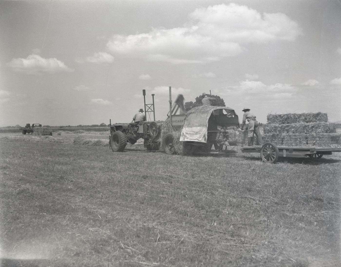 #44 Tractor Pulling a Trailer Filled with Hay, 1943