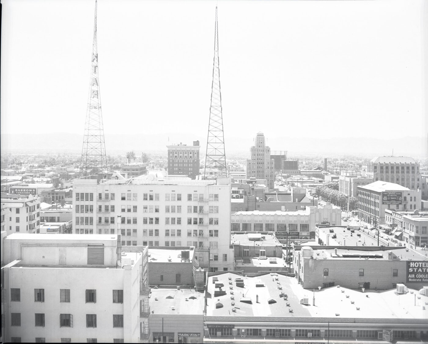 #19 Cityscape of Phoenix, 1946. View looking south from a rooftop at approximately Central and Van Buren. KTAR’s towers on the Heard Building are visible in the foreground.