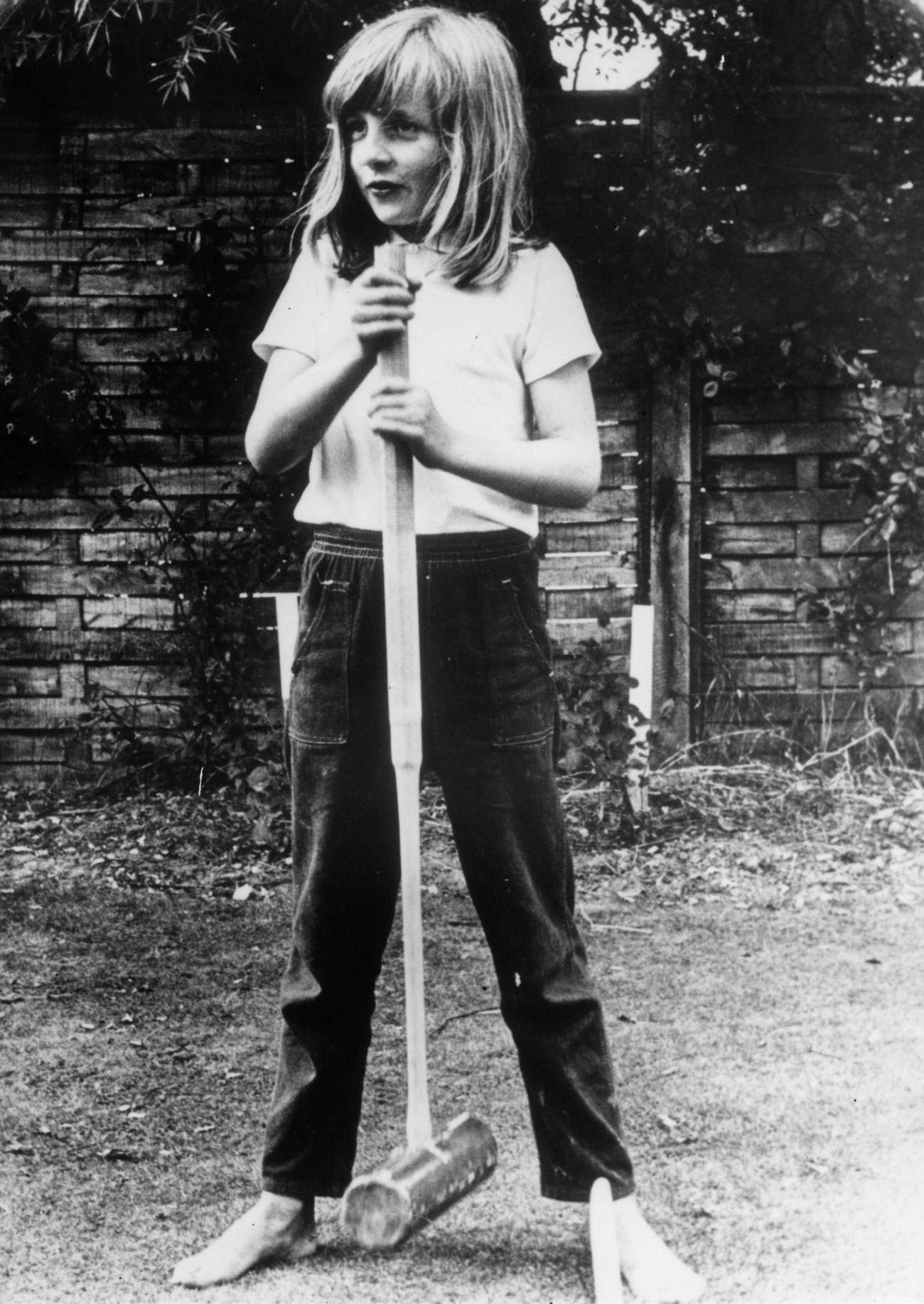 #4 Lady Diana Spencer holding a croquet mallet during a game at Itchenor, West Sussex, 1970