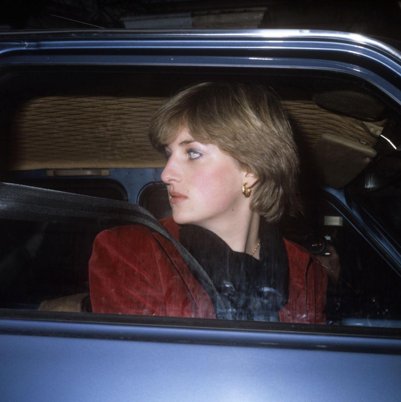#27 Lady Diana Spencer who has been linked romantically with the Prince of Wales, leaves her London flat in her car after being pursued by the media.