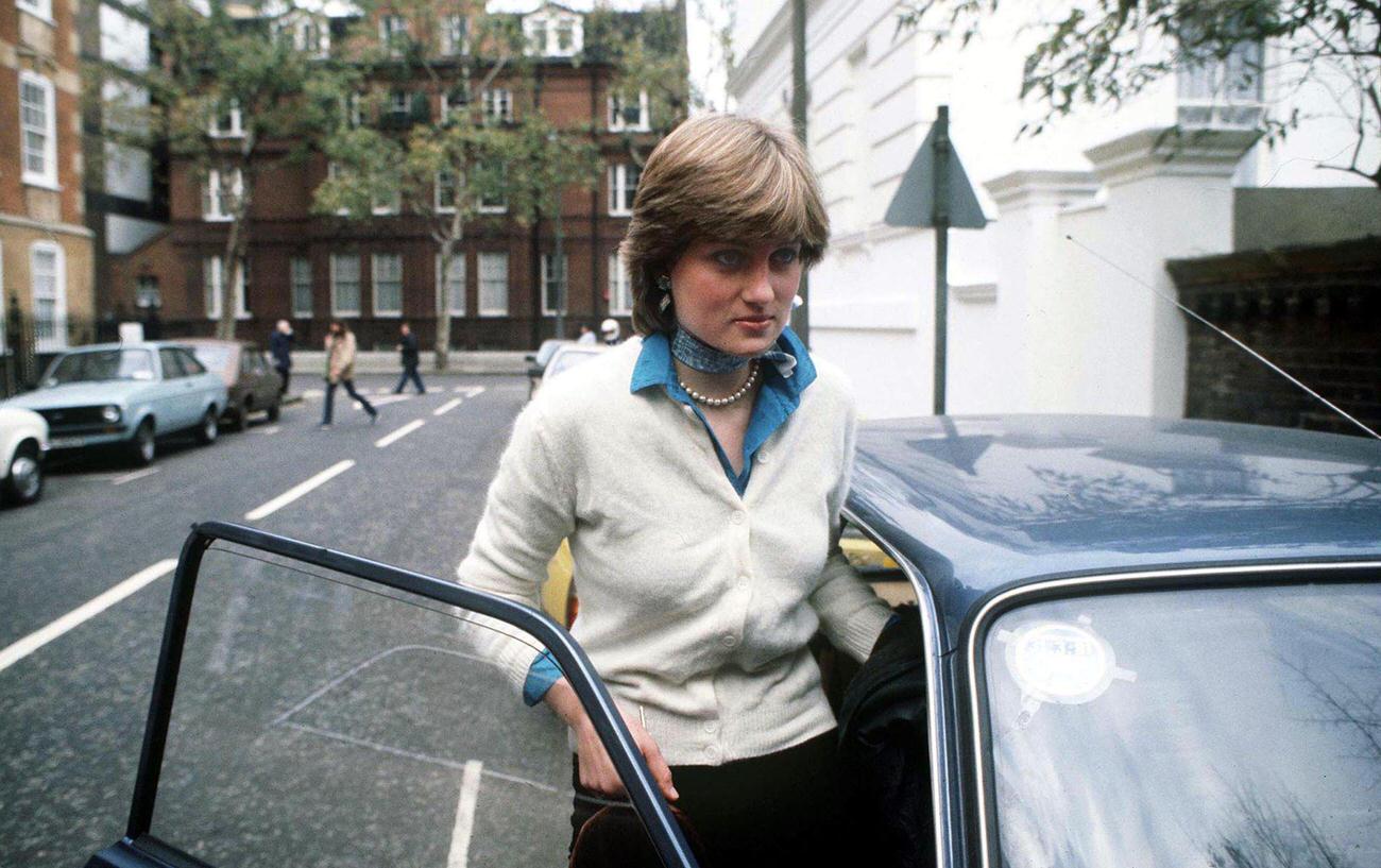 #32 Lady Diana Spencer outside her flat in Coleherne Court, London, before her engagement to the Prince of Wales, December 1980.
