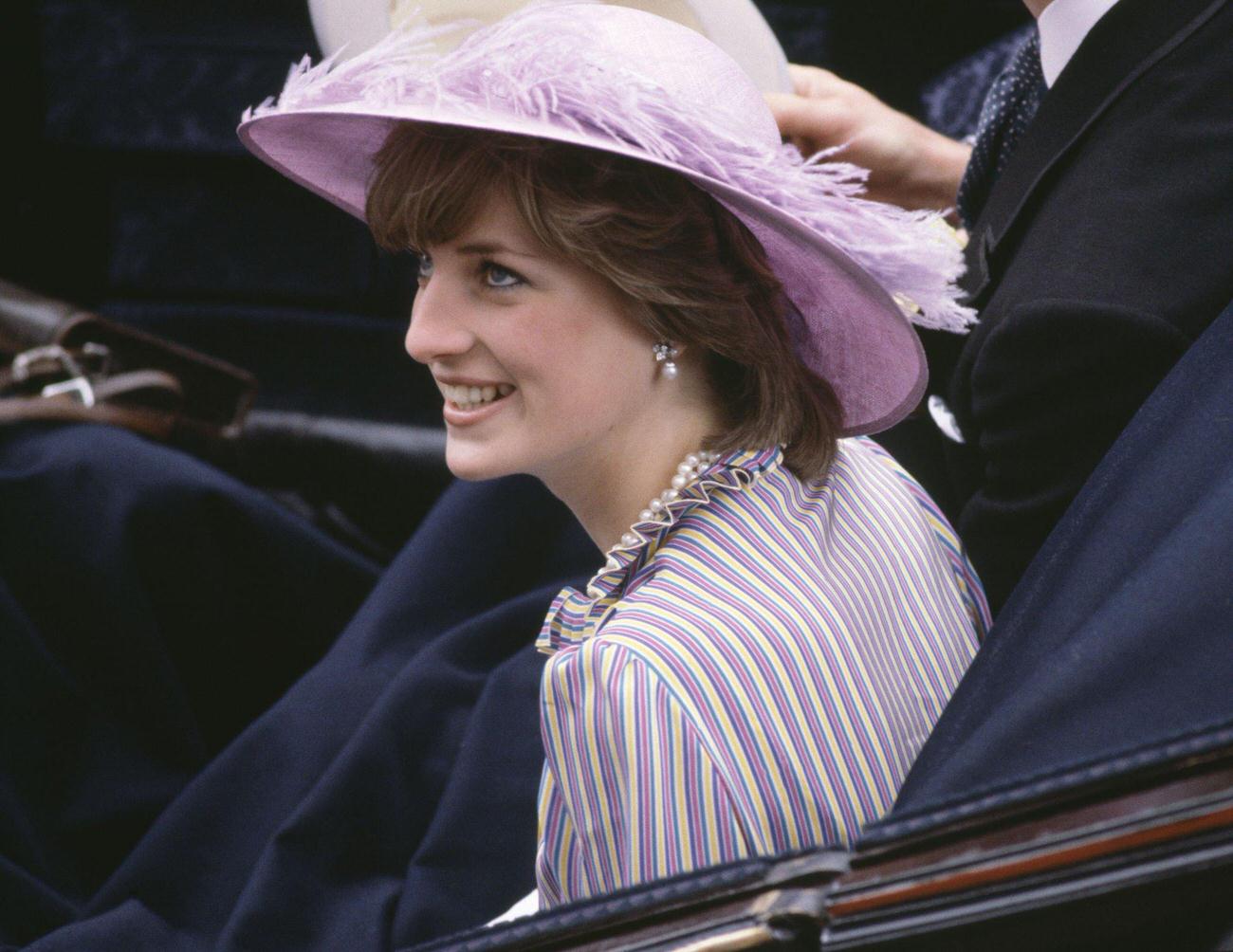 #41 Lady Diana Spencer in a purple hat, 1980