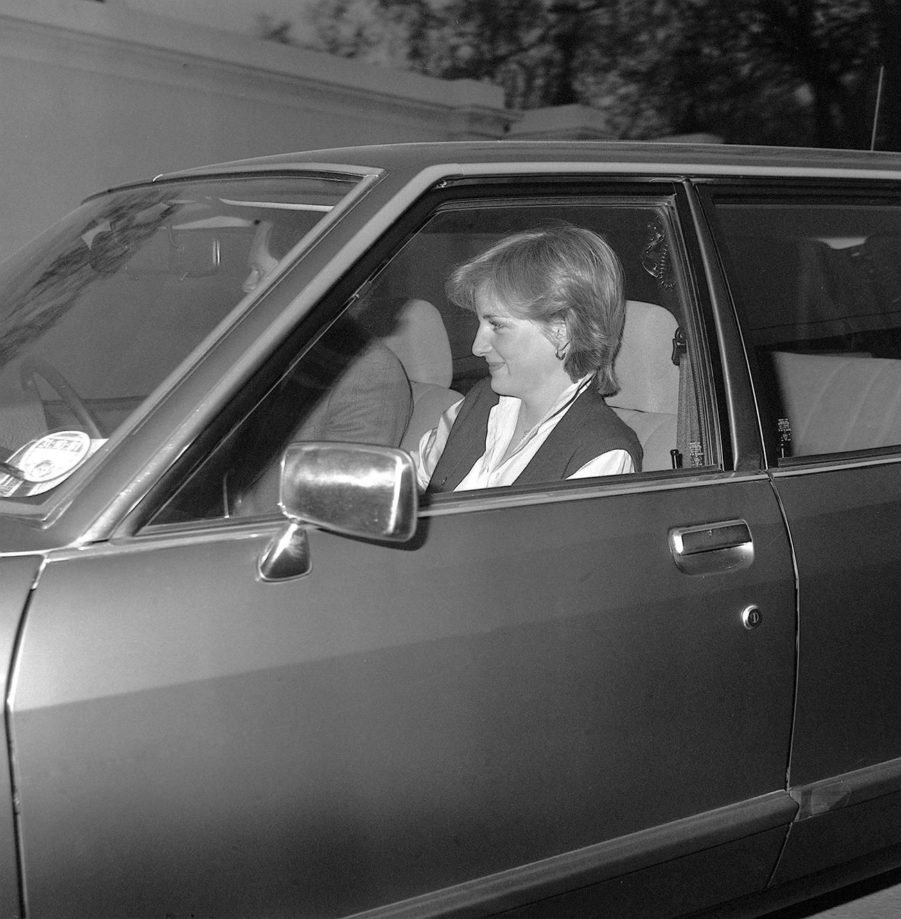 #45 A smiling Lady diana Spencer, the 19-year old fiancee of Prince Charles being driven into her temporary new home after a visit to Buckingham Palace.