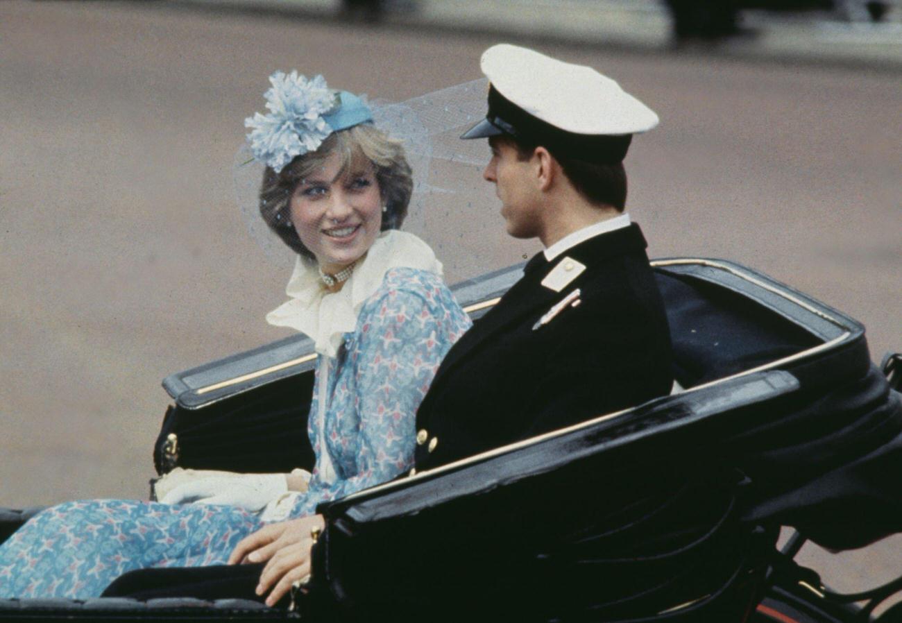 #54 Lady Diana Spencer wearing a blue floral Bill Pashley outfit with a matching hat, and Prince Andrew in a carriage during the Trooping the Colour ceremony in London, England, 13th June 1981.