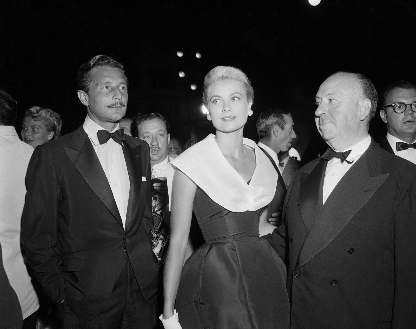 Alfred Hitchcock, Grace Kelly and Oleg Cassini at the premiere of “Rear Window.”