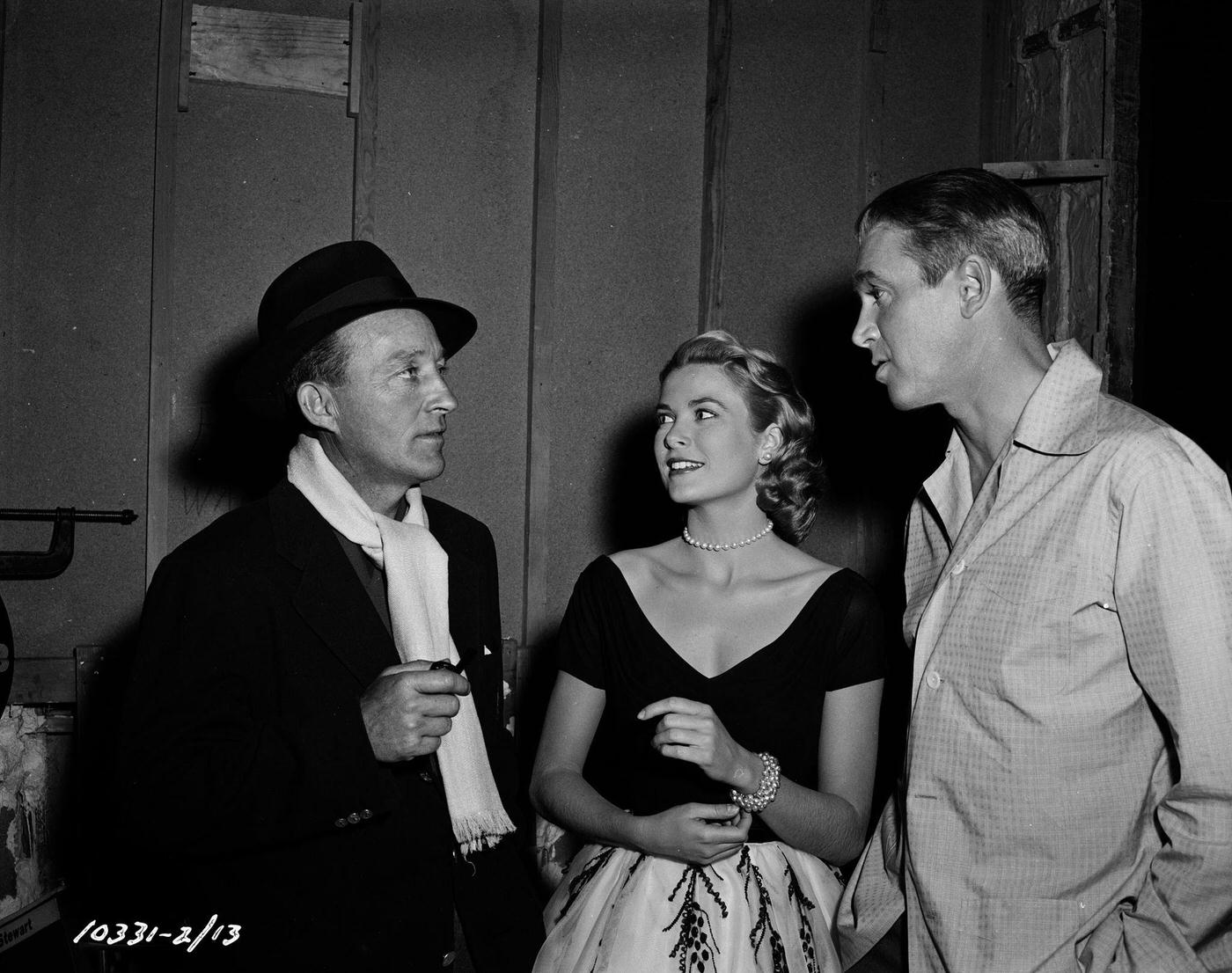 Bing Crosby visiting actors Grace Kelly and James Stewart on the set of their film ‘Rear Window’, 1954.