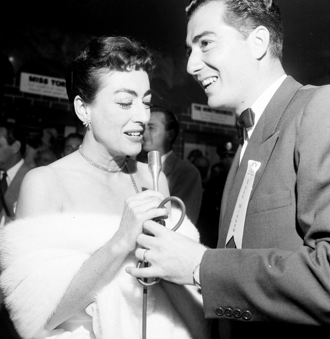Joan Crawford attend a premiere “Rear Window” in Los Angeles, California.