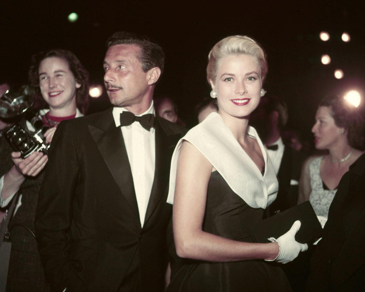 Grace Kelly attends the premiere of the film ‘Rear Window’ with fashion designer Oleg Cassini