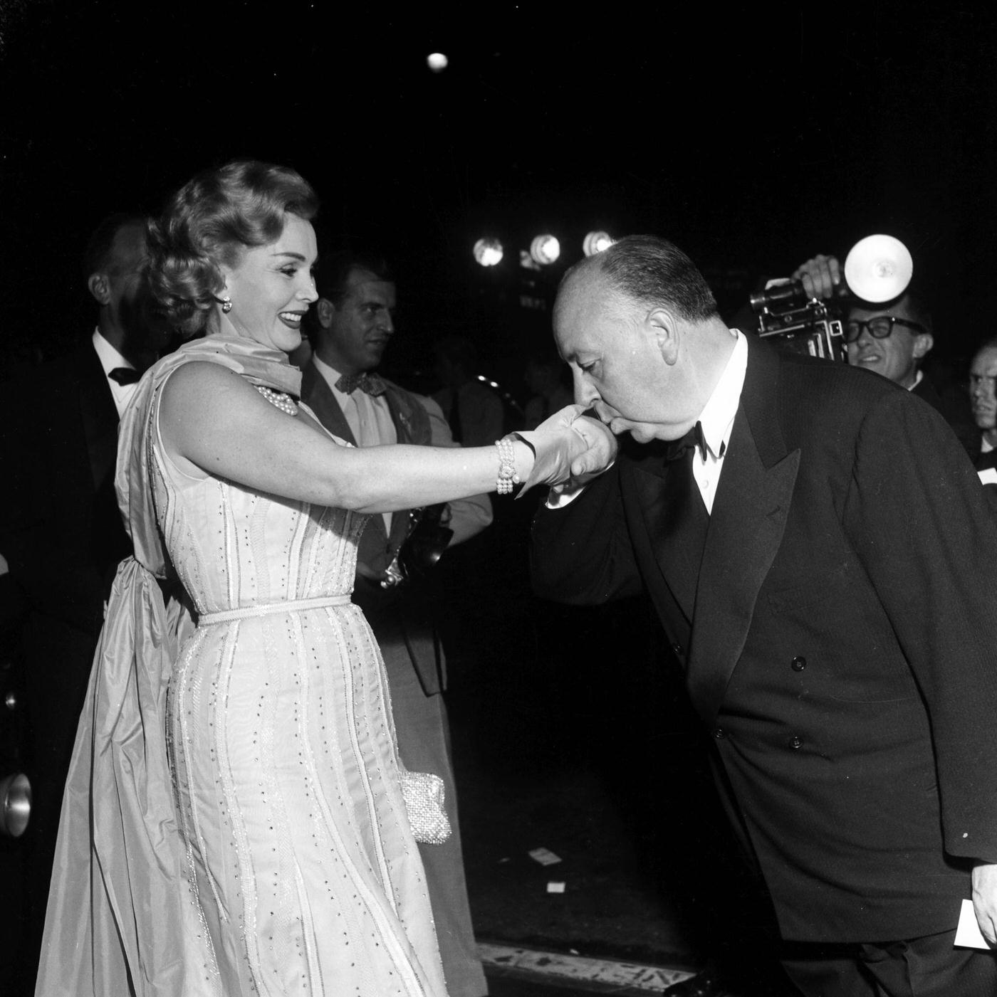 Director Alfred Hitchcock with guest at the premier of “Rear Window” in Los Angeles