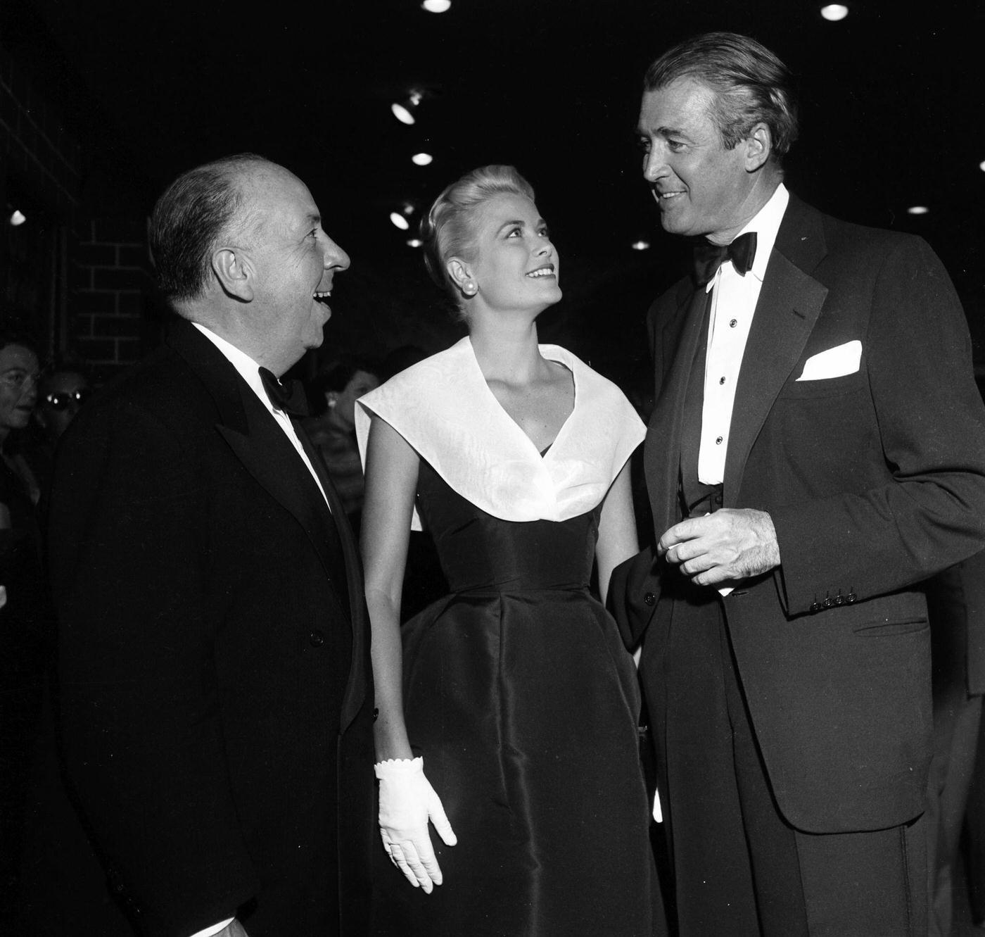 Alfred Hitchcock with Grace Kelly and Jimmy Stewart at the premier of “Rear Window”