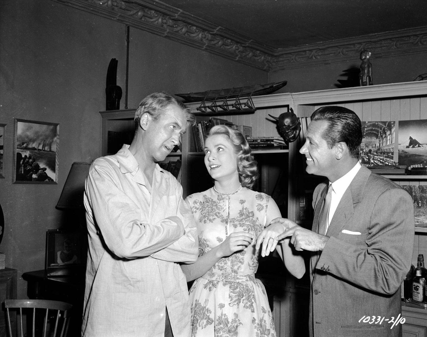 William Holden points out Grace Kelly’s engagement ring to James Stewart in a moment of fun on the set of Hitchcock’s ‘Rear Window’.