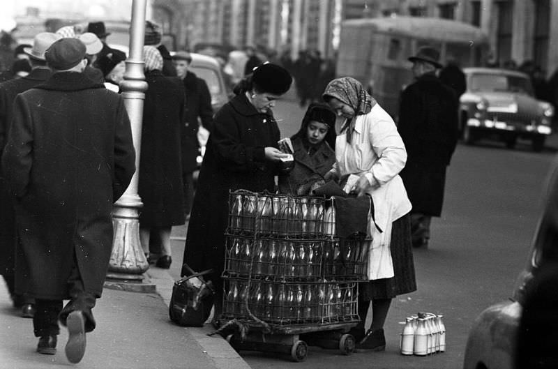#48 Mother and son buying milk from a vendor.