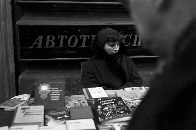 #60 A young bookseller at her stall.