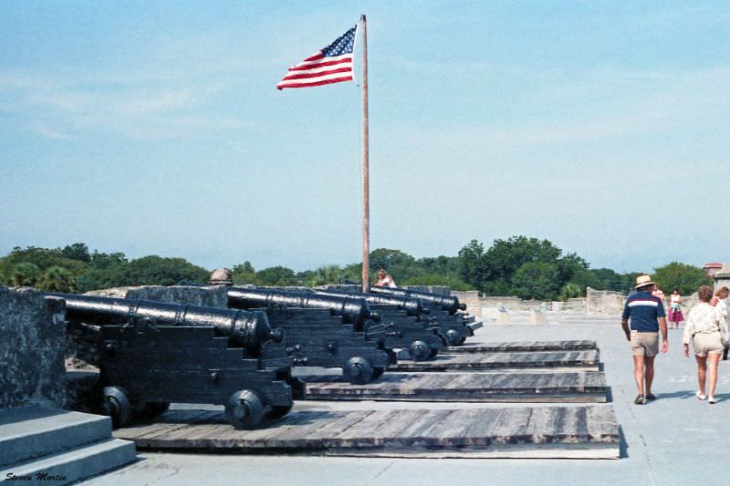 #21 Row of cannons and U.S. flag flying over the fort, Castillo de San Marcos, St. Augustine, 1986