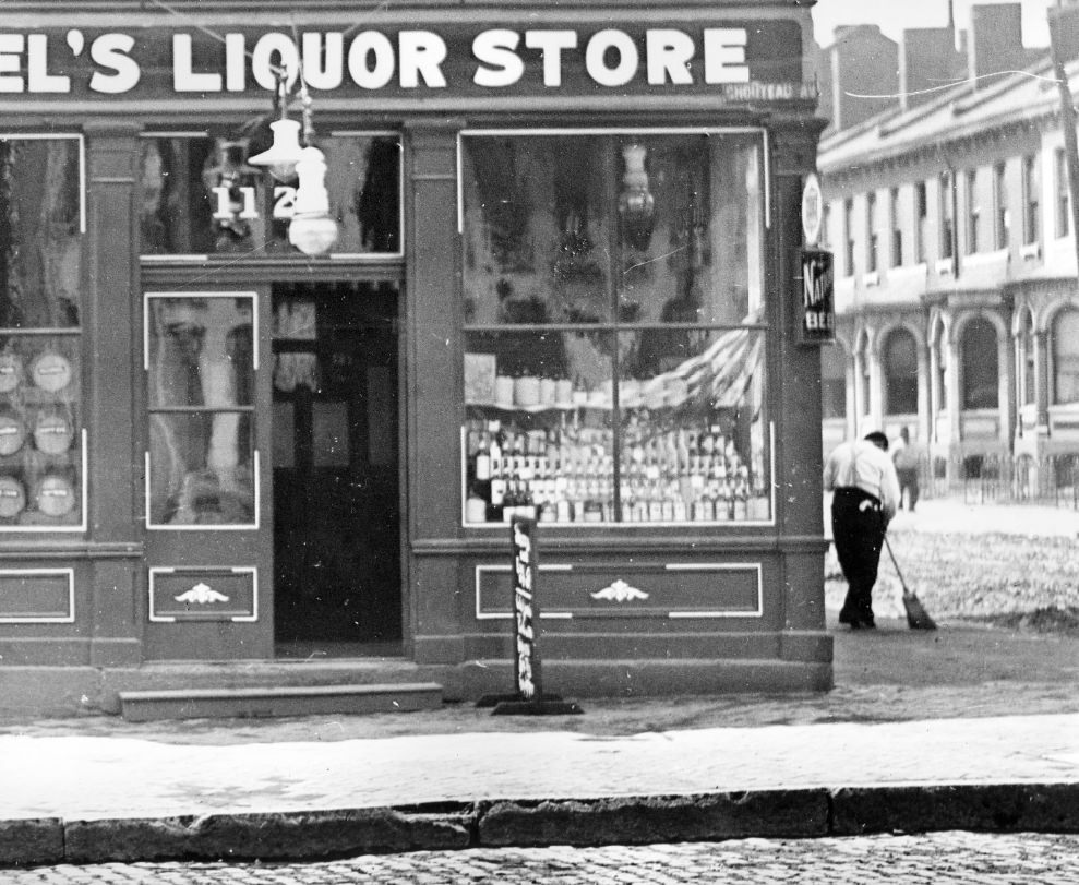 #104 Store front of liquor store on Chouteau Avenue, 1900.