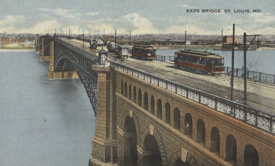 #167 Streetcars cross the Eads Bridge, which spans the Mississippi River from St. Louis, 1900