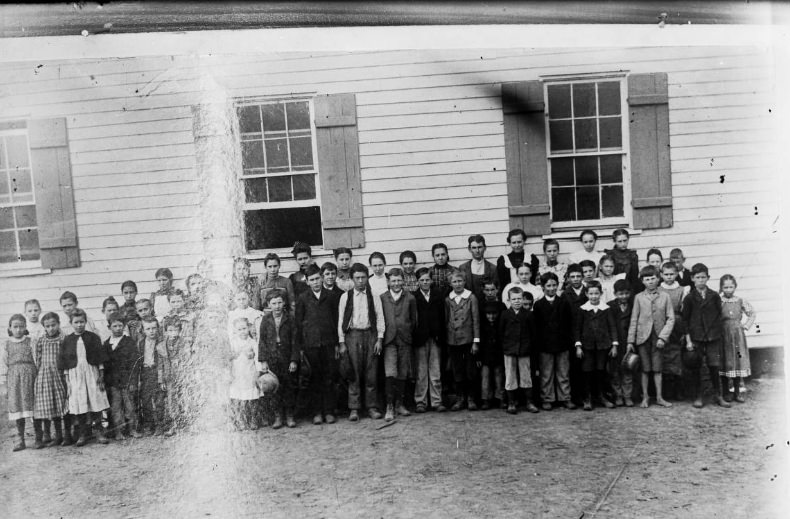 #209 Group of school-age children, 1900