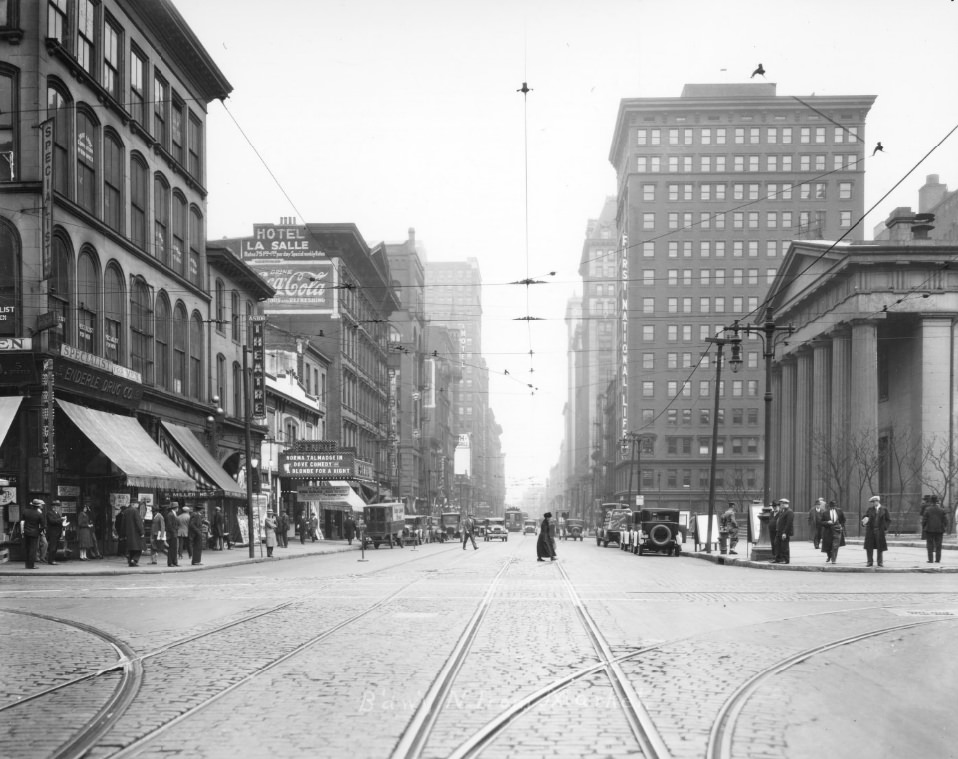 #93 Broadway North from Market Street, 1900. The old Courthouse is visible on the right, theaters and a hotel are visible on the left across from the Courthouse.