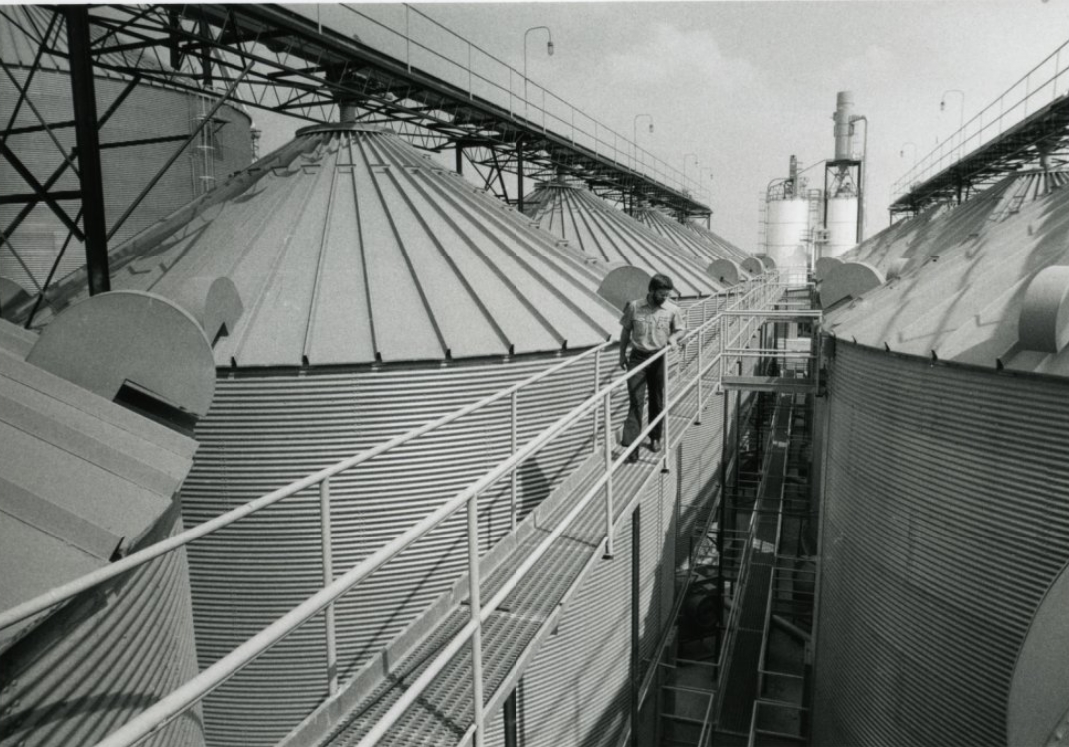 #39 A worker inspects the Jonesboro, Arks, rice mill of Busch Agricultural Resources Inc, 1984