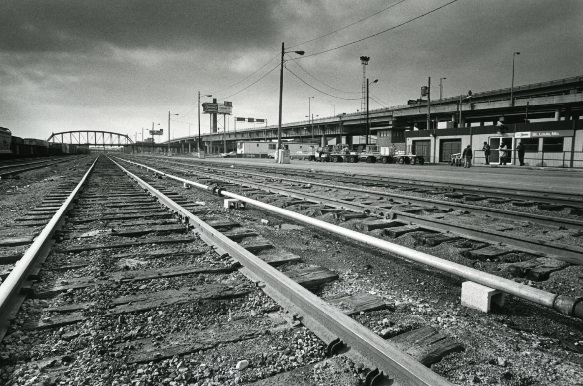 #94 A shot of the passengers walking down the walkway, 1980