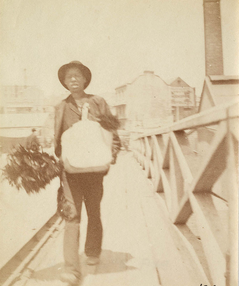 #7 A chimney sweep walking across Pyrmont Bridge Sydney, 1888