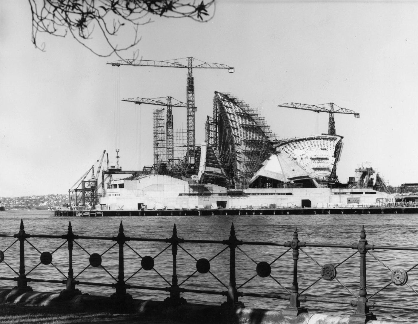 #90 Construction of the shell-shaped roof of the new opera house in Sydney harbour, 1963