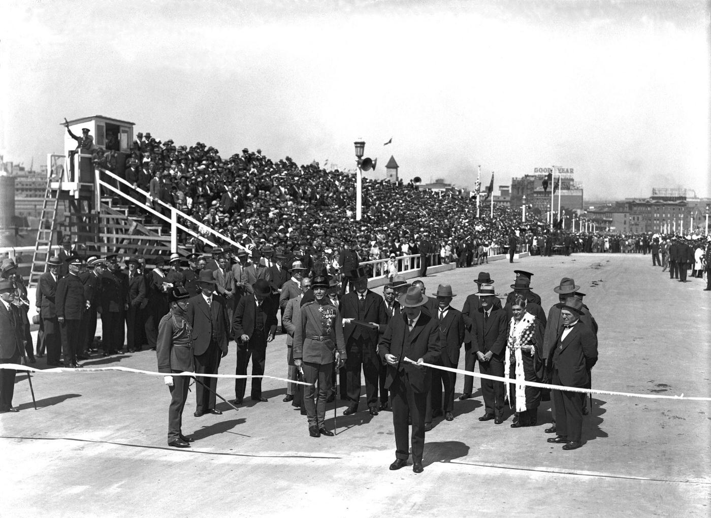 #31 Sydney Harbor Bridge Opening. NSW Premier Jack Lang cuts the ribbon at the official opening of the Sydney Harbor Bridge.