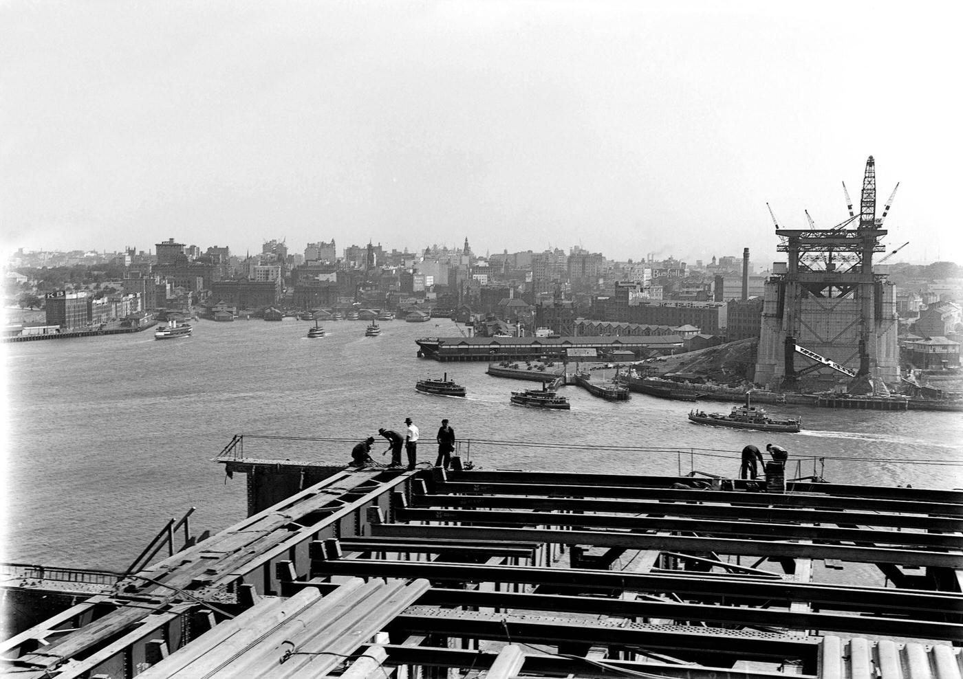 #43 Looking across to Circular Quay from the North Pylon of the Sydney Harbour Bridge during its construction in the 1920s