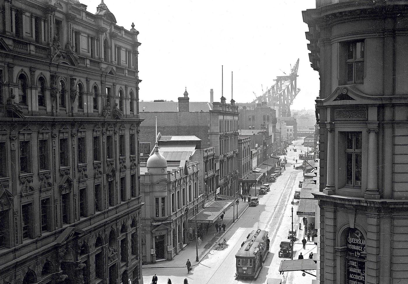 #45 Pitt Street, Sydney in the 1920s with construction of the Sydney Harbor Bridge in the background.